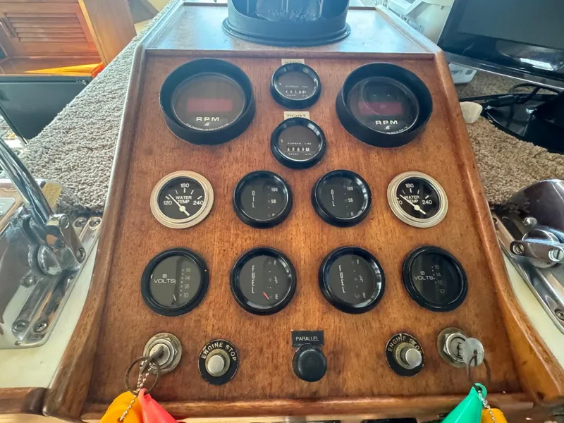 Slide: The Image of 1984 Tollycraft 48 Cockpit Motor Yacht dashboard with gauges and controls. - 31