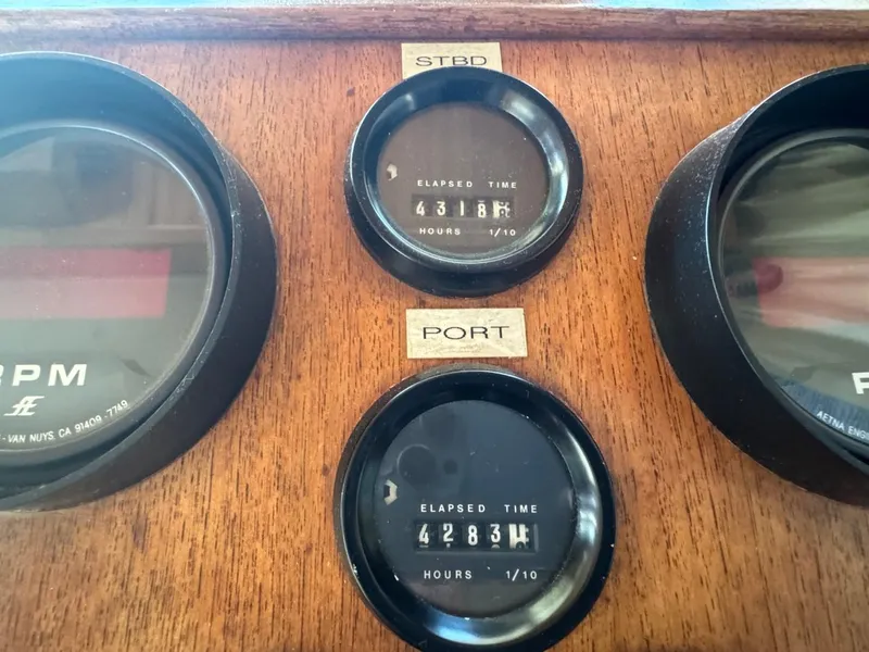 Slide: The Image of Gauges on 1984 Tollycraft 48 Cockpit Motor Yacht dashboard showing engine hours. - 32