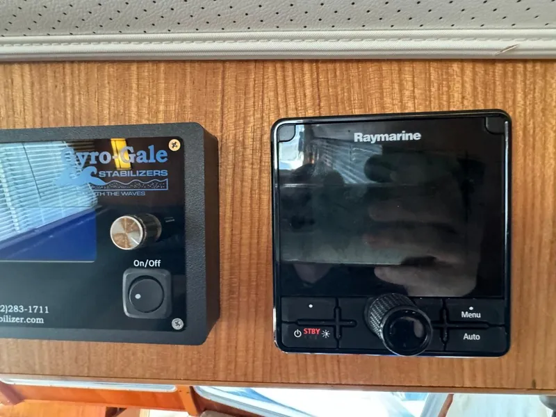 Slide: The Image of Control panel of a 1984 Tollycraft 48 Cockpit Motor Yacht with Raymarine and Gyro Gale stabilizers. - 34