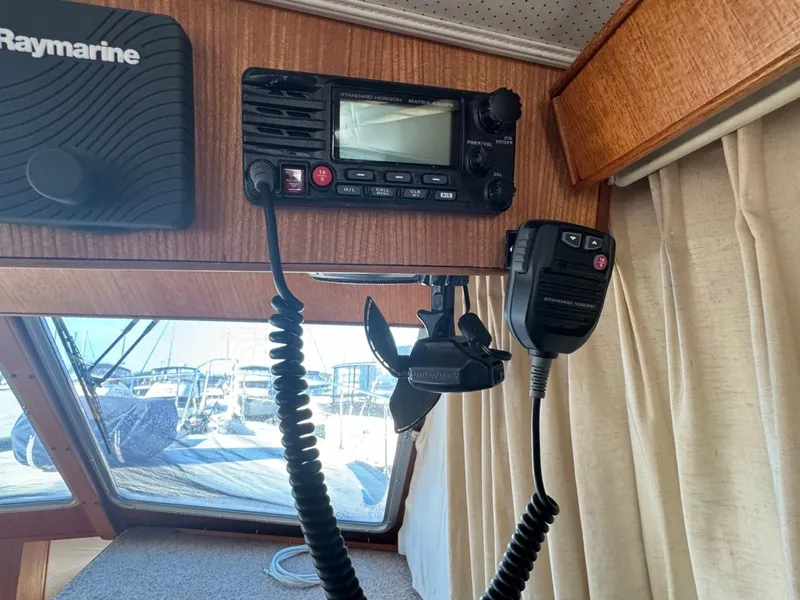 Slide: The Image of 1984 Tollycraft 48 Cockpit Motor Yacht interior with radio and navigation equipment. - 35