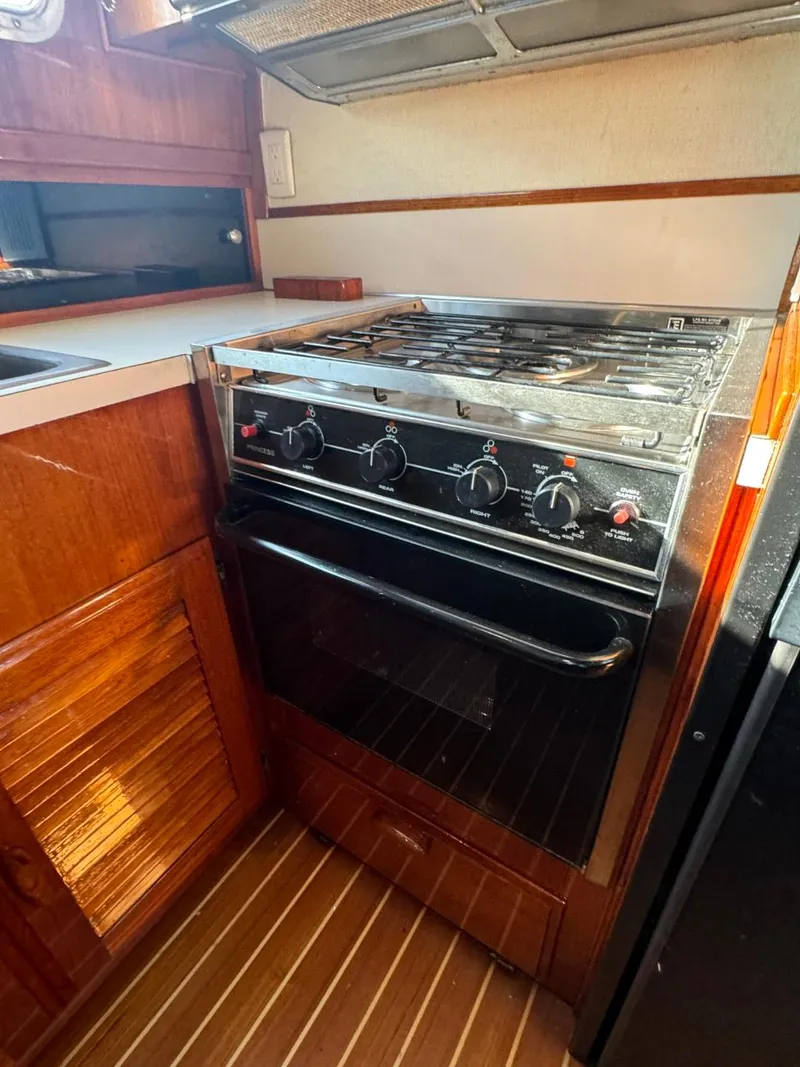Slide: The Image of 1984 Tollycraft 48 Cockpit Motor Yacht kitchen with stove and oven. - 39