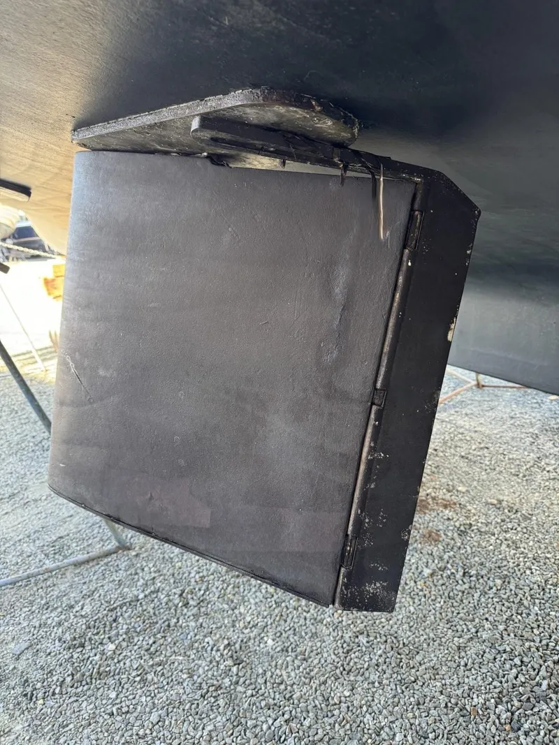 Slide: The Image of 1984 Tollycraft 48 Cockpit Motor Yacht hull detail, showing underwater structure on gravel surface. - 7