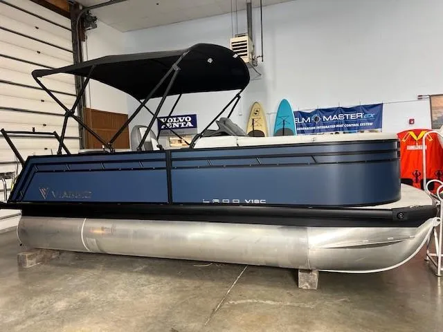 The Image of 2025 Viaggio Lago V 18 pontoon boat in indoor showroom. - 0