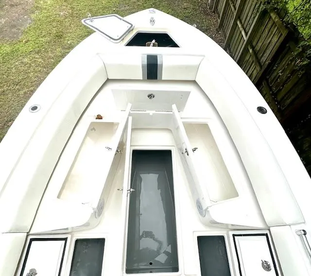 Slide: The Image of 2011 Contender 28 Sport boat interior with open storage compartments. - 10