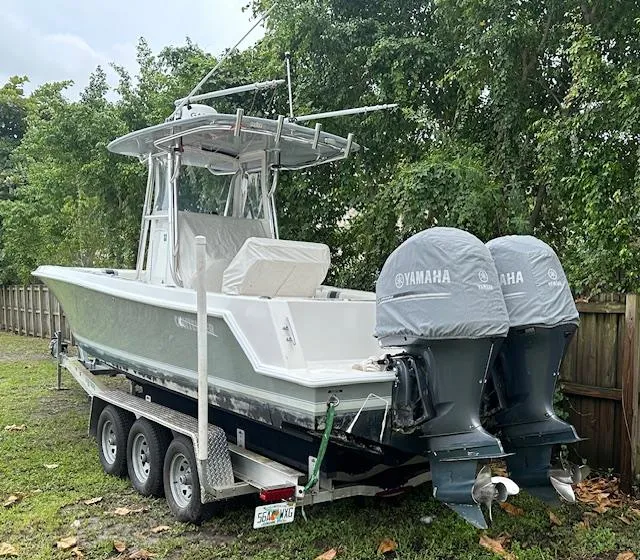 Slide: The Image of 2011 Contender 28 Sport boat with dual Yamaha engines on a trailer. - 3