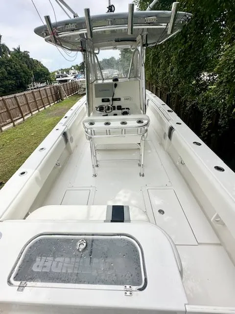 Slide: The Image of 2011 Contender 28 Sport boat, spacious deck, center console, fishing-ready. - 5
