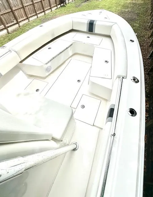 Slide: The Image of 2011 Contender 28 Sport boat with spacious seating and storage compartments. - 7