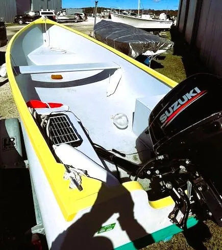 The Image of 2021 Skiff Jericho Bay Lobster boat with Suzuki outboard motor on trailer. - 1