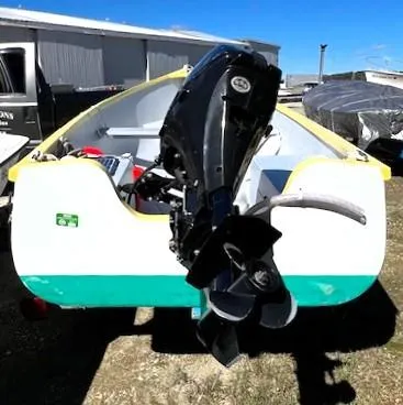 Slide: The Image of 2021 Skiff Jericho Bay Lobster boat with outboard motor, parked outdoors. - 4