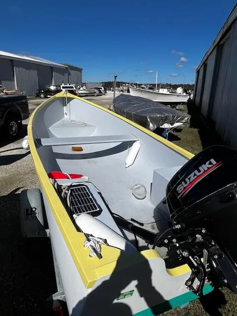 Slide: The Image of 2021 Skiff Jericho Bay Lobster boat with Suzuki motor, parked outdoors. - 5