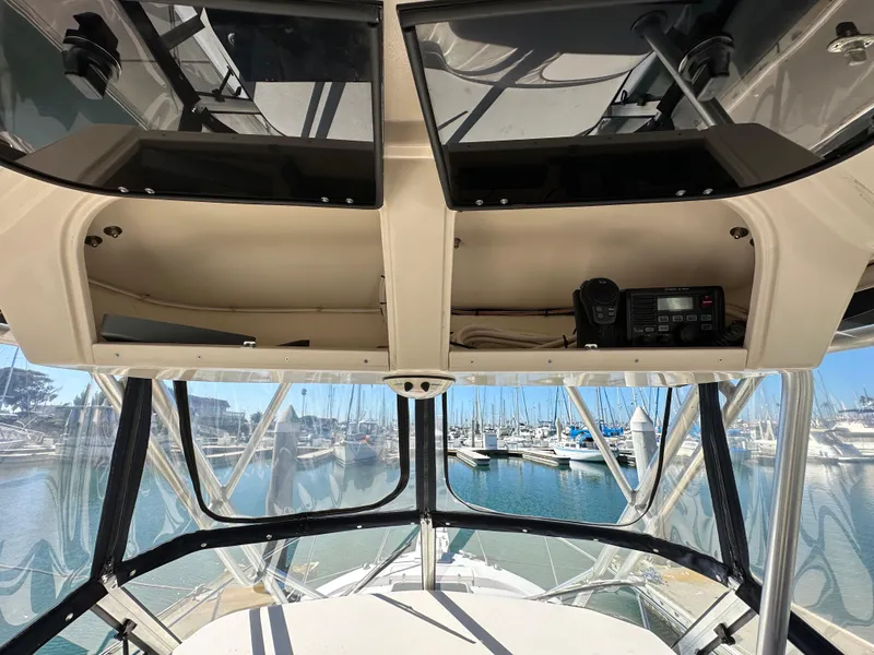 Slide: The Image of Interior view of 2002 Grady-White 282 Sailfish boat with marina in background. - 10