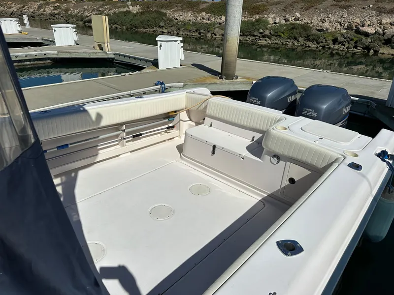 Slide: The Image of 2002 Grady-White 282 Sailfish boat interior with twin Yamaha engines at dock. - 6