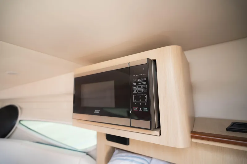 Slide: The Image of Microwave in 2023 Regal 26 XO boat interior, modern design. - 10