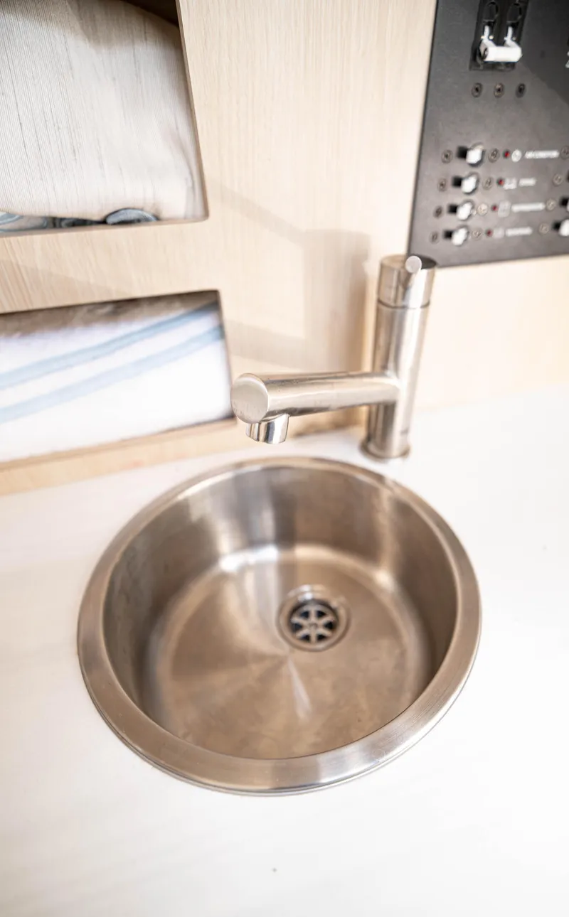 Slide: The Image of Stainless steel sink in 2023 Regal 26 XO boat interior. - 9