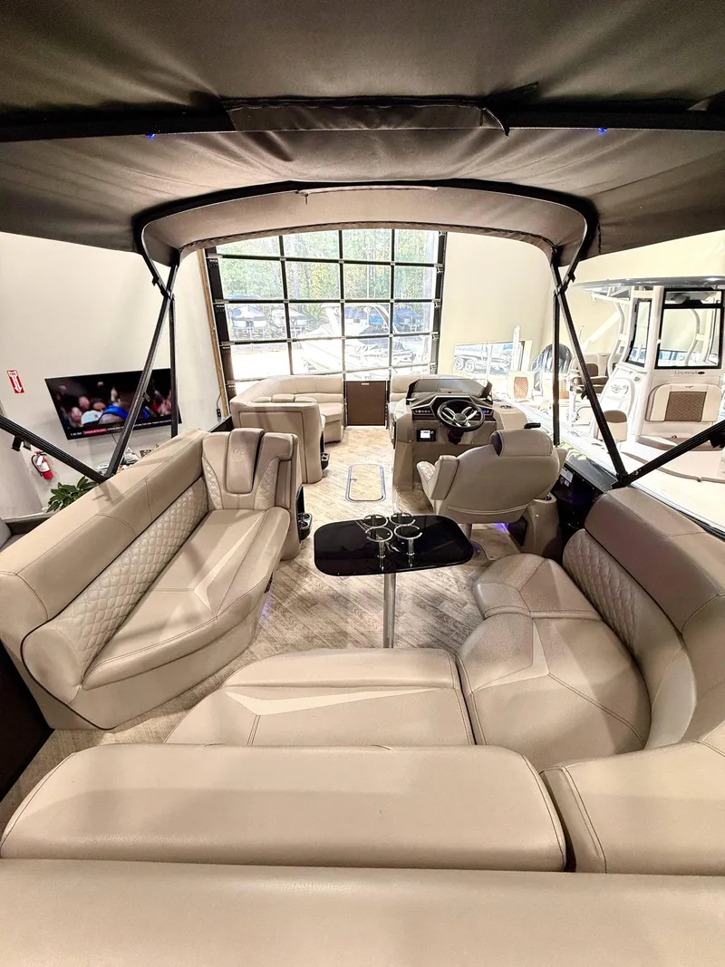 Slide: The Image of Luxurious interior of 2019 Manitou 25 SES Platinum pontoon boat with plush seating. - 4