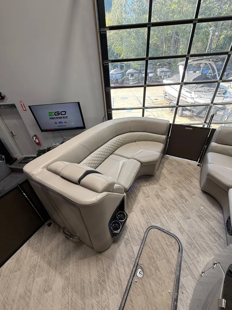 Slide: The Image of 2019 Manitou 25 SES Platinum boat interior with luxurious seating and modern design. - 8