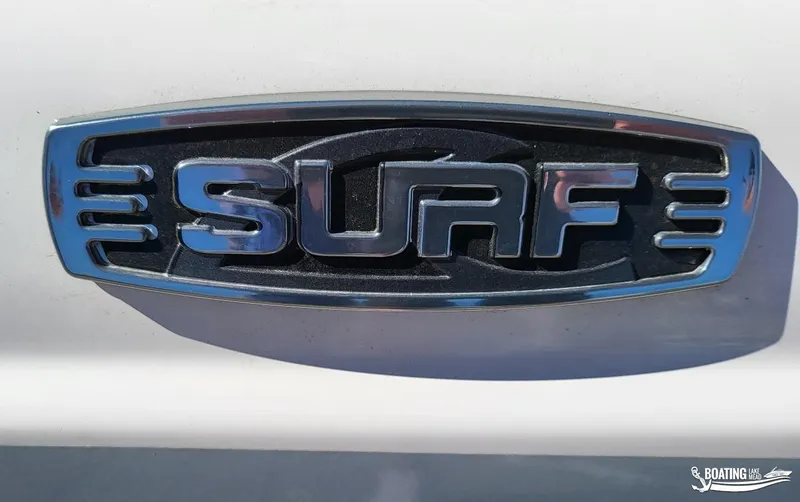 Slide: The Image of 2021 Chaparral 23 Surf logo emblem on boat exterior. - 19