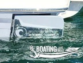 Slide: The Image of 2021 Chaparral 23 Surf boat on Lake Mead, showcasing sleek design and water interaction. - 20