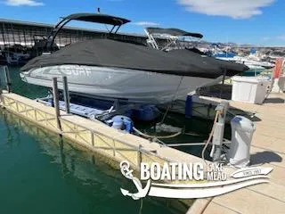 Slide: The Image of 2021 Chaparral 23 Surf boat docked at Lake Mead marina. - 22