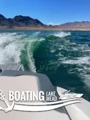 Slide: The Image of Chaparral 23 Surf 2021 boat cruising on Lake Mead with scenic mountain backdrop. - 23