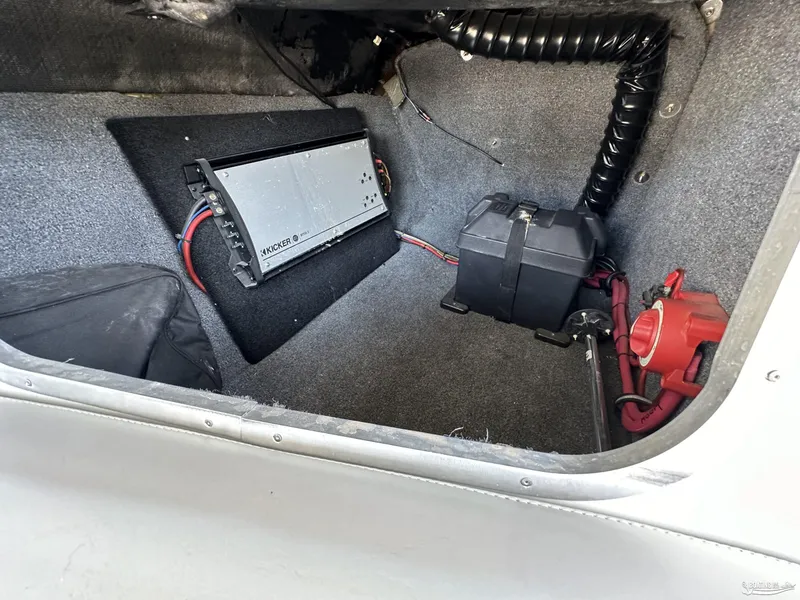 Slide: The Image of 2012 Axis A22 boat interior with Kicker amplifier and battery setup. - 12