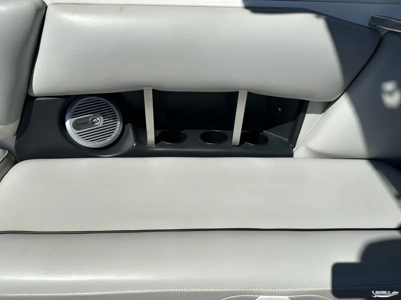 Slide: The Image of 2012 Axis A22 boat interior with speaker and cup holders. - 9