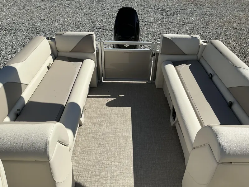 Slide: The Image of 2025 Avalon Venture 23 FT Quad Lounger interior with beige seating and spacious layout. - 7