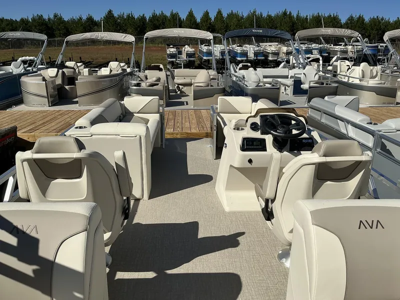 Slide: The Image of 2025 Avalon Venture 23 FT Quad Lounger pontoon boat with luxurious seating and helm. - 8
