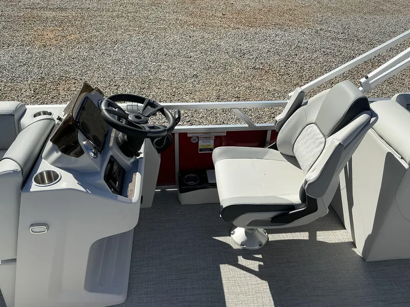 Slide: The Image of 2025 Avalon Venture boat interior with steering wheel and captain's chair. - 8