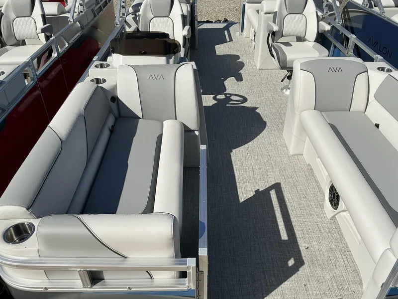 Slide: The Image of 2025 Avalon Venture 21 FT Quad Lounger interior with plush seating and modern design. - 9