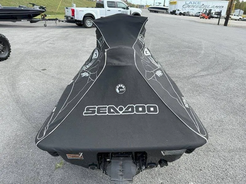 Slide: The Image of 2007 Sea-Doo RXP 215 jet ski covered, parked on asphalt. - 13