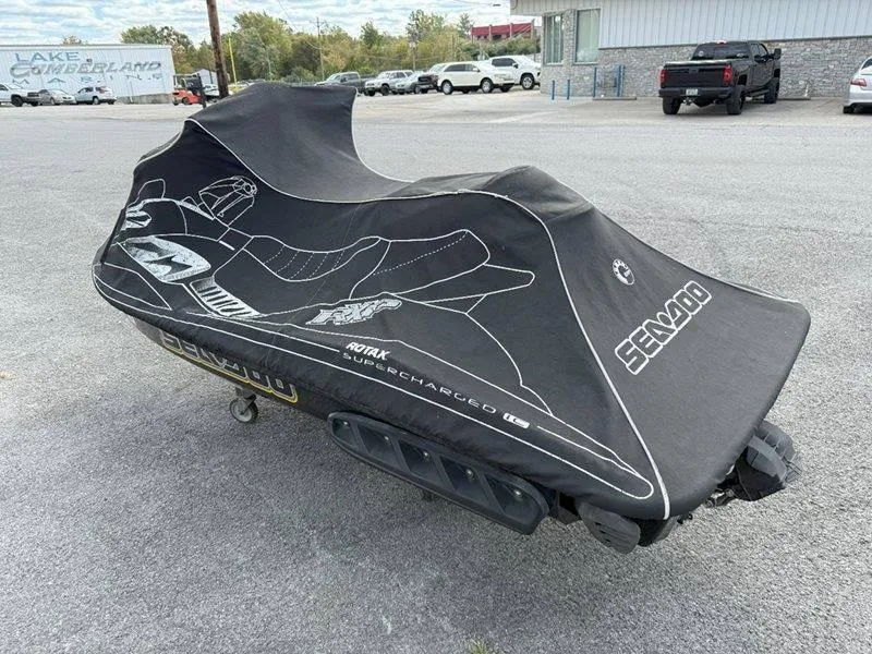 Slide: The Image of 2007 Sea-Doo RXP 215 jet ski covered, parked in a lot. - 14