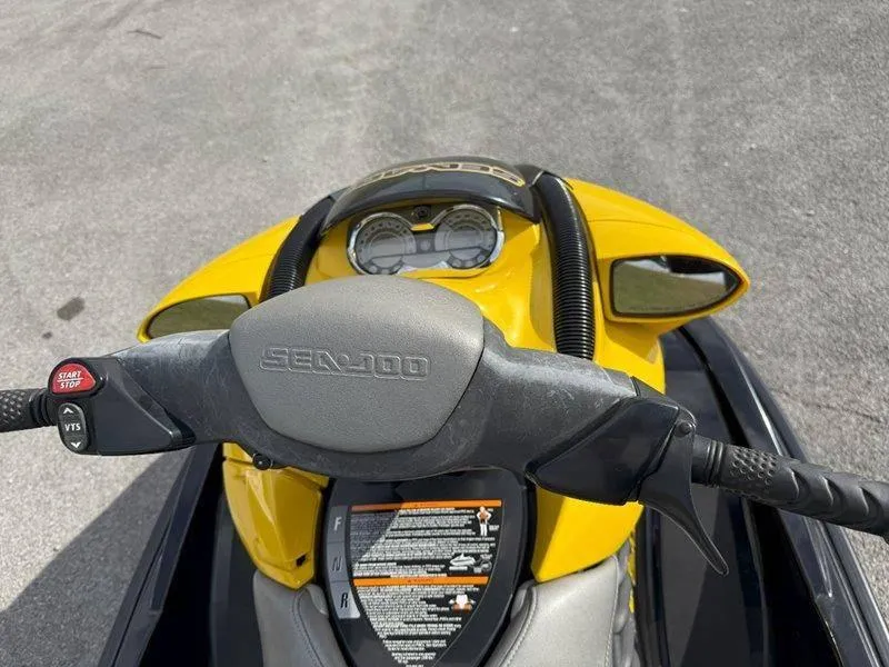 Slide: The Image of 2007 Sea-Doo RXP 215 jet ski dashboard and handlebars, yellow and black design. - 15