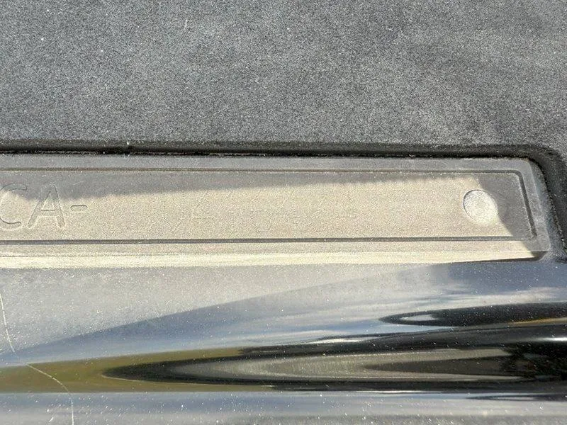 Slide: The Image of Close-up of 2007 Sea-Doo RXP 215 detail, showing textured surface and partial lettering. - 18