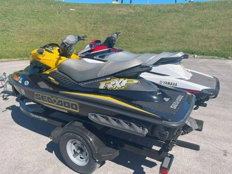 Slide: The Image of 2007 Sea-Doo RXP 215 jet ski on trailer, parked outdoors. - 22