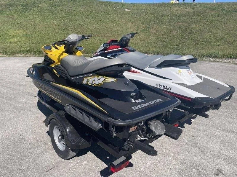 Slide: The Image of Two jet skis on a trailer: 2007 Sea-Doo RXP 215 and a Yamaha model. - 23