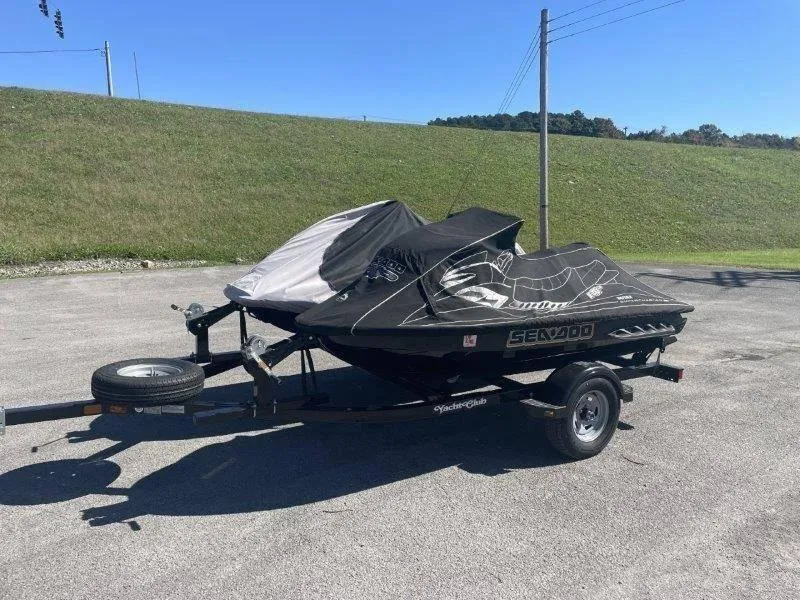 Slide: The Image of 2007 Sea-Doo RXP 215 jet ski on trailer, covered, parked outdoors. - 28