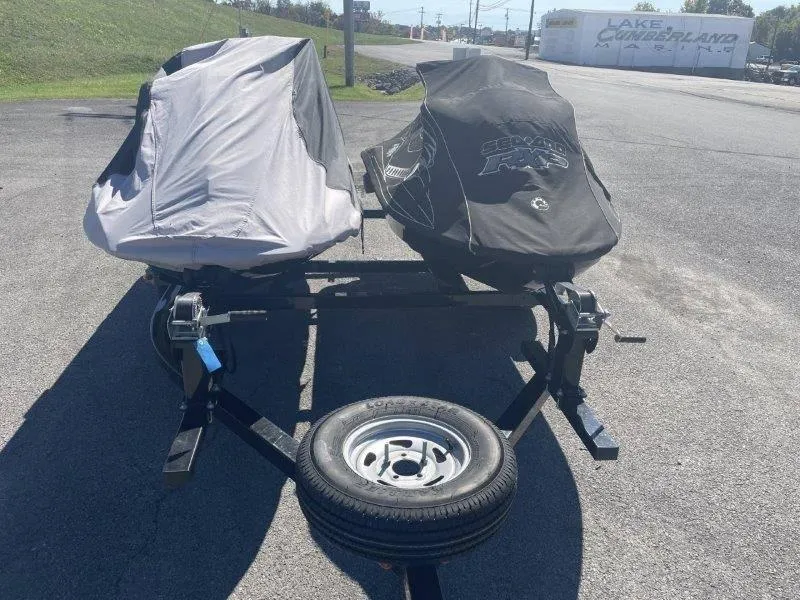 Slide: The Image of Covered 2007 Sea-Doo RXP 215 jet skis on trailer in parking lot. - 41