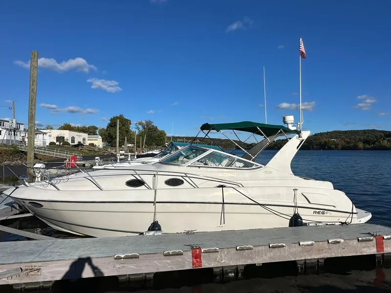 The Image of 1997 Regal 292 Commodore boat docked on a sunny day. - 0