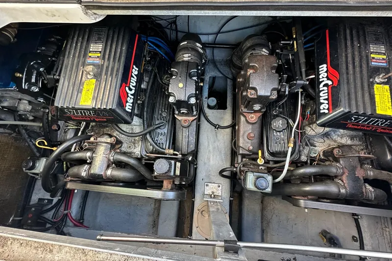 Slide: The Image of Twin MerCruiser engines in a 1997 Regal 292 Commodore boat. - 23