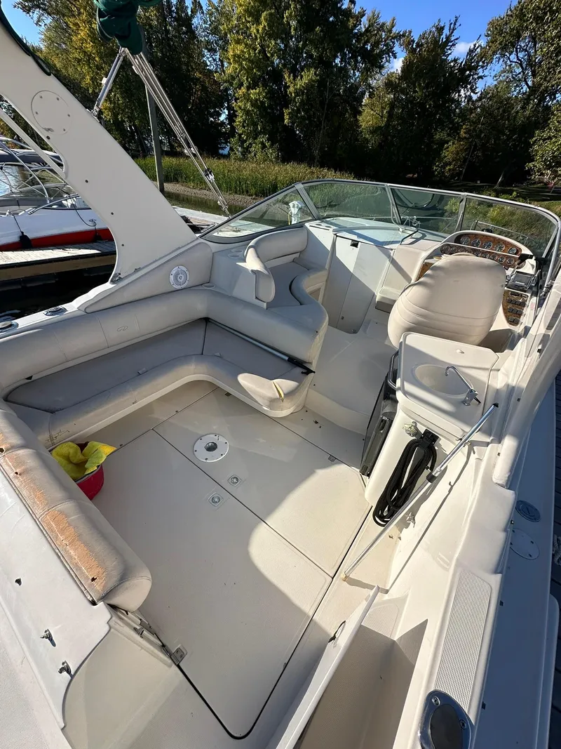 Slide: The Image of 1997 Regal 292 Commodore boat interior with seating and steering wheel. - 9