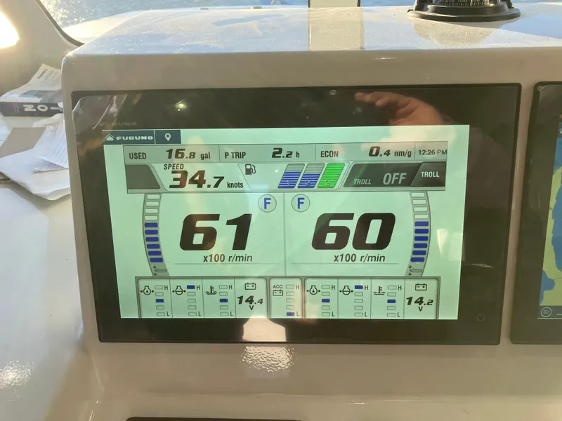 Slide: The Image of Millennium Marine NuWave Walkaround 2023 dashboard displaying speed and engine RPM data. - 32