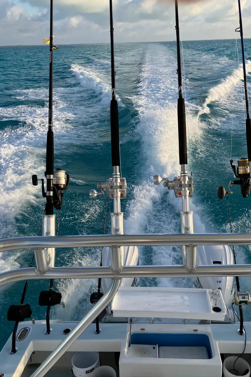 Slide: The Image of 2023 Millennium Marine NuWave Walkaround with fishing rods on ocean waters. - 41