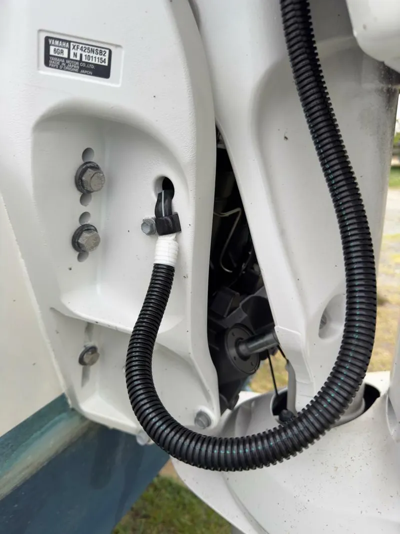 Slide: The Image of Close-up of 2023 Millennium Marine NuWave Walkaround boat engine wiring and components. - 6