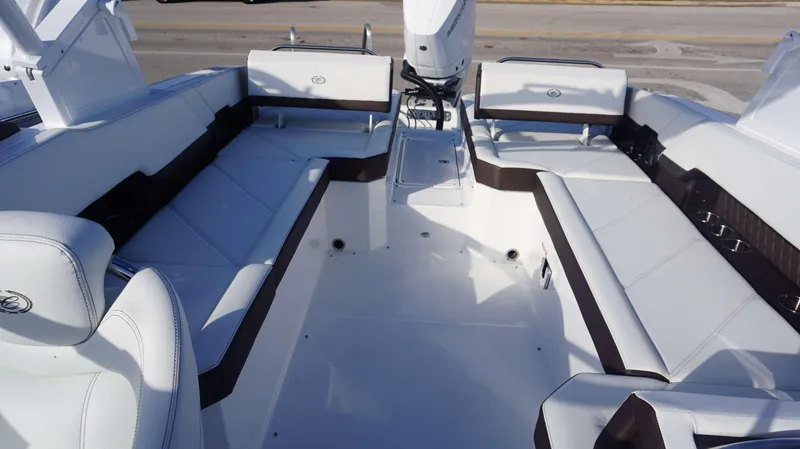 Slide: The Image of 2025 Cobalt R8 boat interior with white seating and modern design. - 12