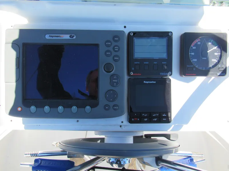 Slide: The Image of Control panel of a 1999 Beneteau 381 sailboat with navigation instruments. - 16
