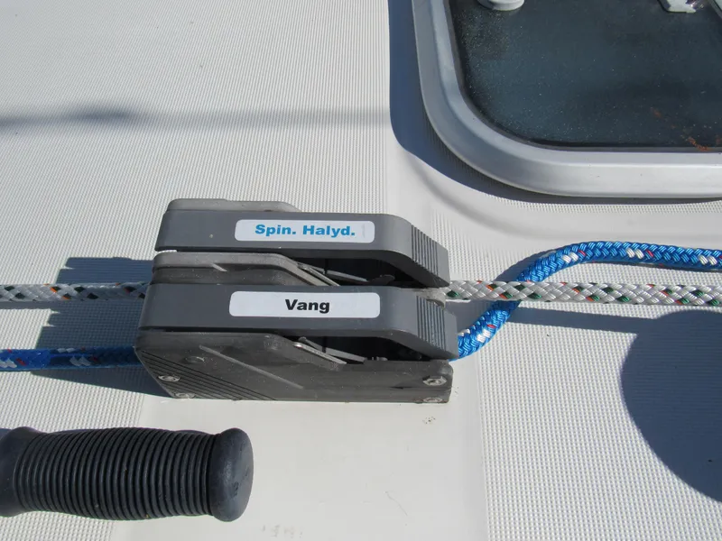 Slide: The Image of Deck hardware on a 1999 Beneteau 381 sailboat, featuring labeled rope clutches. - 21