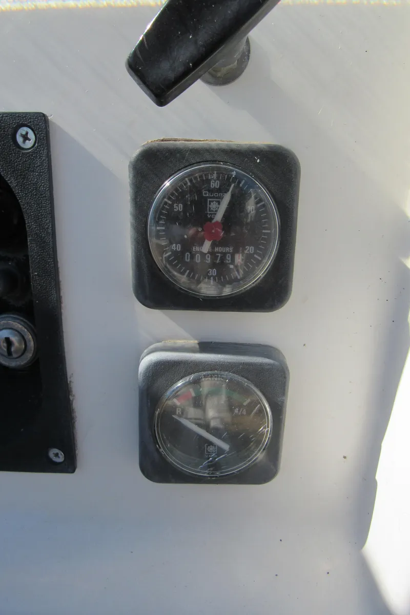 Slide: The Image of Close-up of Beneteau 381 1999 boat gauges and controls. - 28