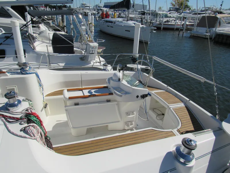 Slide: The Image of Cockpit of a 1999 Beneteau 381 sailboat docked in a marina. - 4