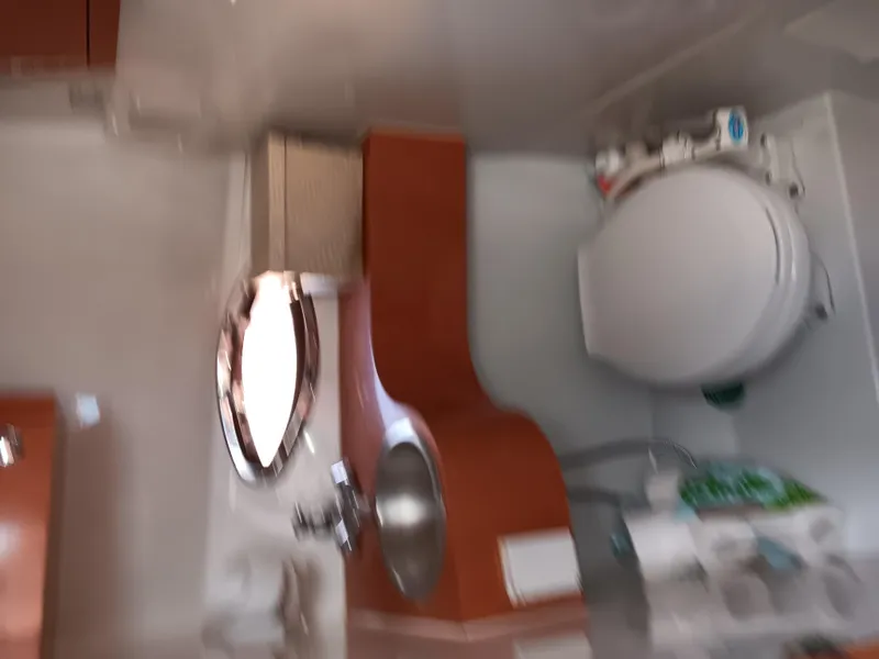 Slide: The Image of Interior of 2001 Celebrity 280 Express Cruiser bathroom with sink and toilet. - 14